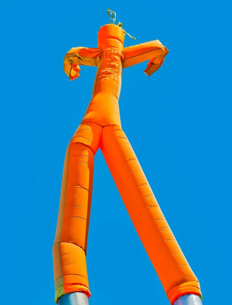 Orange inflatable man — Stock Photo, Image