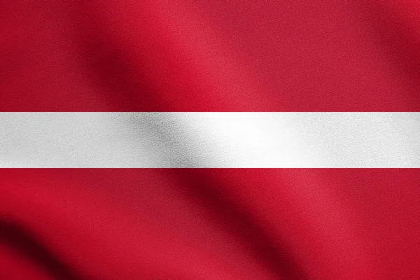 Флаг Латвии, машущий ветром с текстурой ткани — стоковое фото