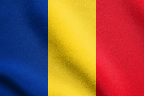 Flag of Romania waving in wind with fabric texture — Stock Photo, Image