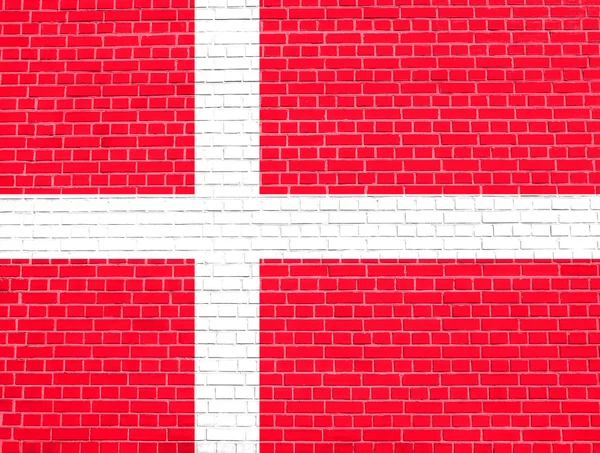 Danimarka bayrağı tuğla duvar doku arka plan üzerinde — Stok fotoğraf