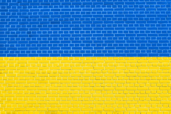 Bandera de Ucrania sobre fondo de pared de ladrillo textura — Foto de Stock