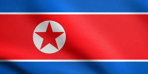 Βόρειας Κορέας σημαία κυματίζει με υφή υφάσματος, λ.δ. της Κορέας — Φωτογραφία Αρχείου