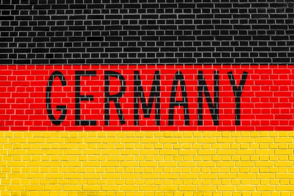 Niemiecki Niemcy flaga i słowo na ceglany mur — Zdjęcie stockowe