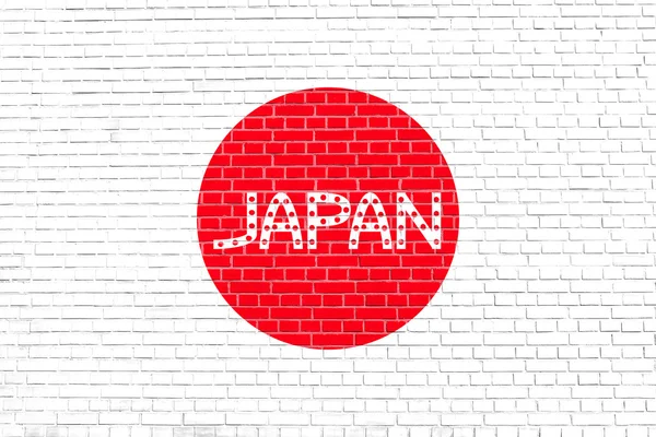 Japanische Flagge und japanisches Wort auf Ziegelmauer — Stockfoto