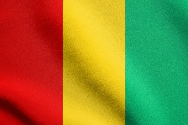 Guinea zászlaja szövet textúrával — Stock Fotó