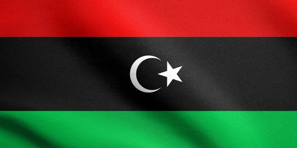 利比亚国旗挥舞着织物纹理 — 图库照片