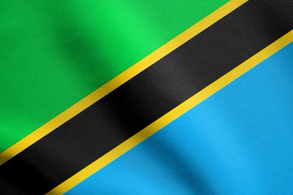 Bandiera della Tanzania sventola con trama in tessuto — Foto Stock