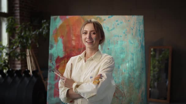 Young Girl Artist Standing Near Painting With Brushes In Her Hands. — Stock Video