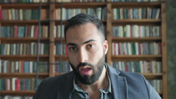 Portrait Of Young Oriental Guy In The Library. — Stock Video