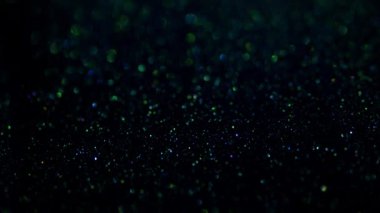 Mavi ve Sarı Kristaller Siyah Arkaplanda Parlıyor. Sıvı Sanat.