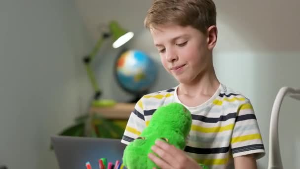 Boy Of Seven Years Old In The Nursery With Toy In His Hands. Estornuda.. — Vídeo de stock