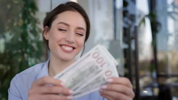 Young Girl Office Worker. She Kisses The Money And Holds It Close To Her. Girl Smiling. — Stok Video