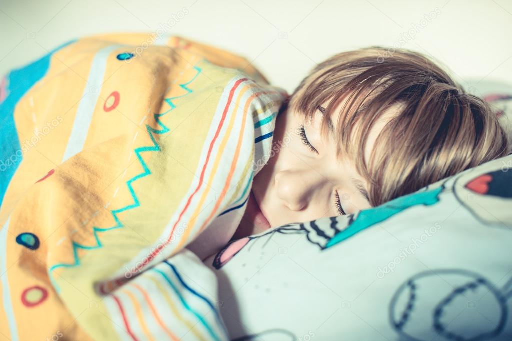 Schoolboy sleep in his bed — Stock Photo © leporiniumberto 105260010