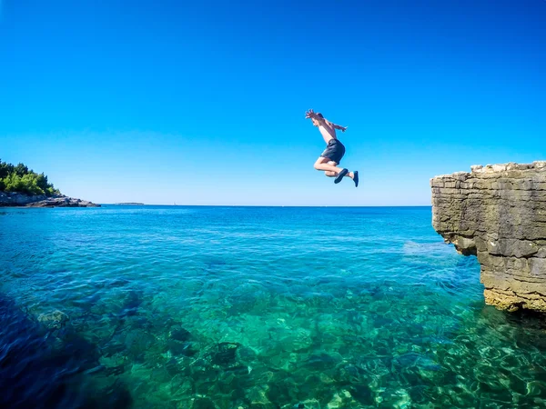 Jumping in the water — Stock Photo, Image