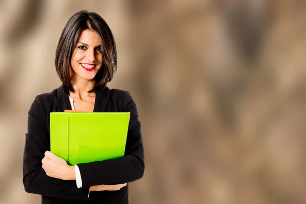 Smiling professional woman on brown background — Stock Photo, Image