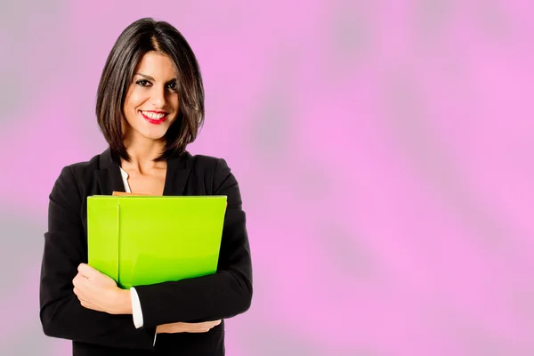 Smiling professional woman on pink background — Stock Photo, Image