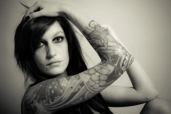 Tattooed sensual woman — Stock Photo, Image