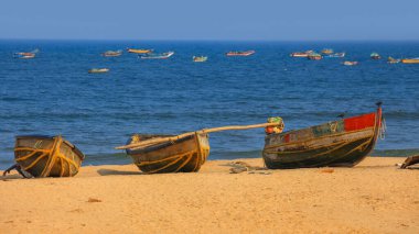 Colorful fishermen boats at Rushikonda beach near Visakhapatnam city in India. clipart