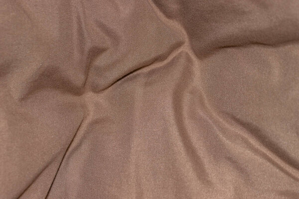 Close up shot of wrinkled satin fabric for background use