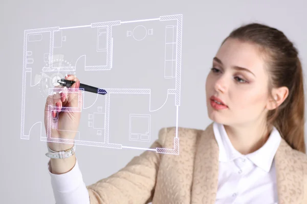 Female architect working with a virtual apartment plan — Stock Photo, Image