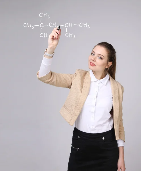 Woman chemist shows a molecular structure — Stock Photo, Image