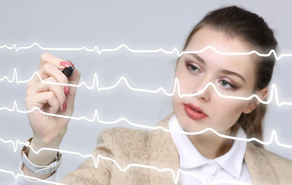 Doctor mujer y líneas de cardiograma —  Fotos de Stock