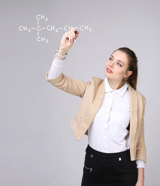 Woman chemist shows a molecular structure — Stock Photo, Image