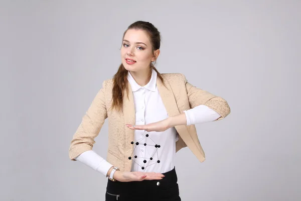 Woman scientist holding model of molecule or crystal lattice. — Stock Photo, Image