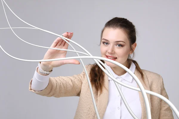 Nő, elektromos kábelek és vezetékek, görbe vonalak — Stock Fotó
