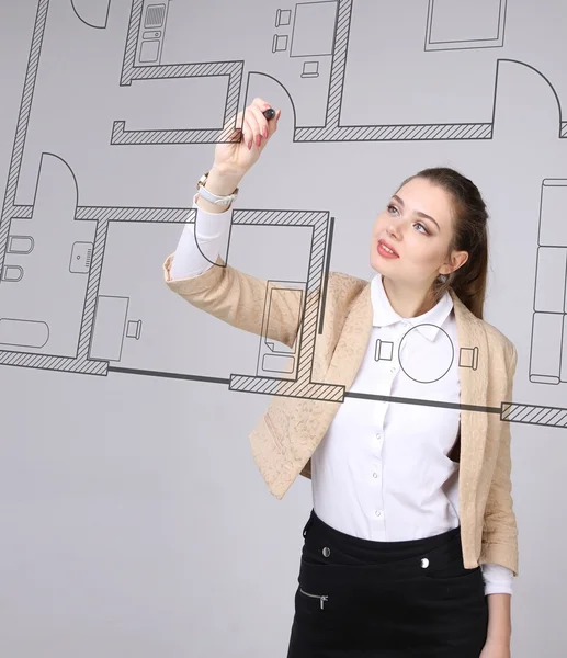 Female architect working with a virtual apartment plan — Stock Photo, Image