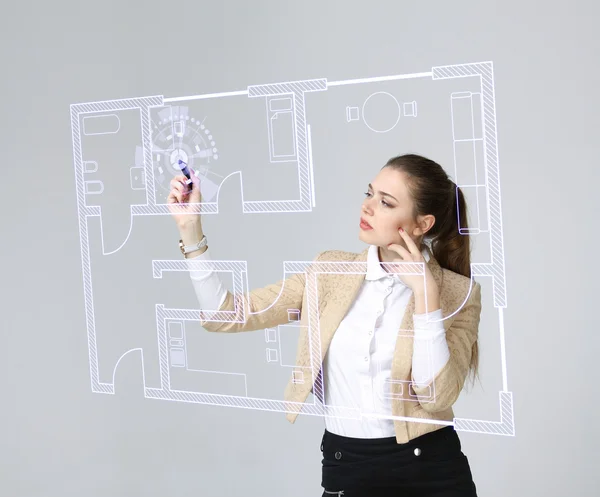 Female architect working with a virtual apartment plan — Stock Photo, Image