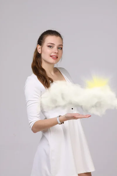 Young woman and sun shining out from behind the clouds, cloud computing  or weather concept — Stock Photo, Image