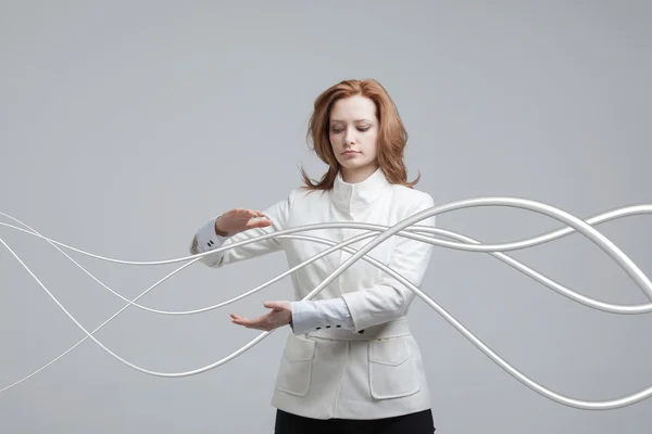 Elektrik kablolar ve teller, kadınla kavisli çizgiler — Stok fotoğraf