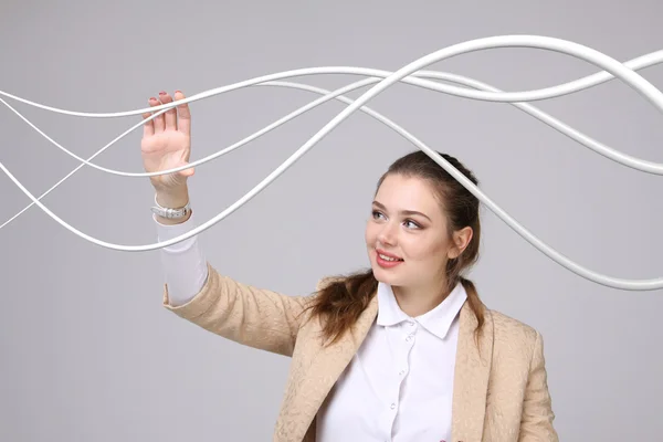 Žena s elektrické kabely nebo dráty, zakřivené čáry — Stock fotografie