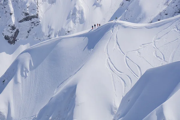 Snowboard freeride, snowboarders and tracks on a mountain slope. Extreme winter sport. — Stock Photo, Image