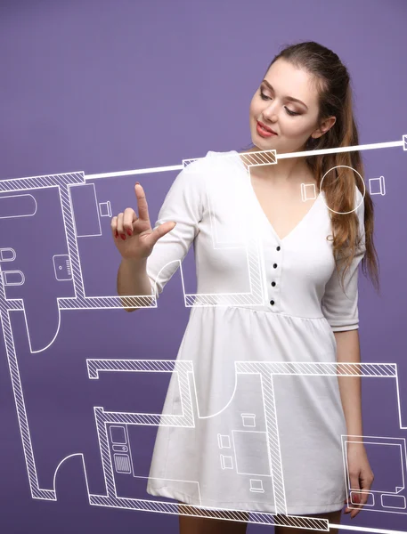 Female architect working with a virtual apartment plan — Stock Photo, Image