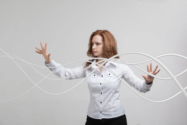 Donna con cavi elettrici o fili, linee curve — Foto Stock