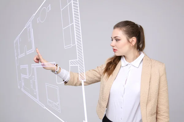 Female architect working with a virtual apartment plan — Stock Photo, Image