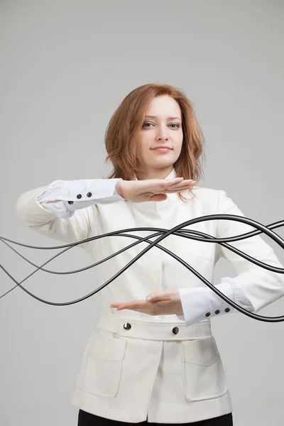Mujer con cables eléctricos o cables, líneas curvas —  Fotos de Stock