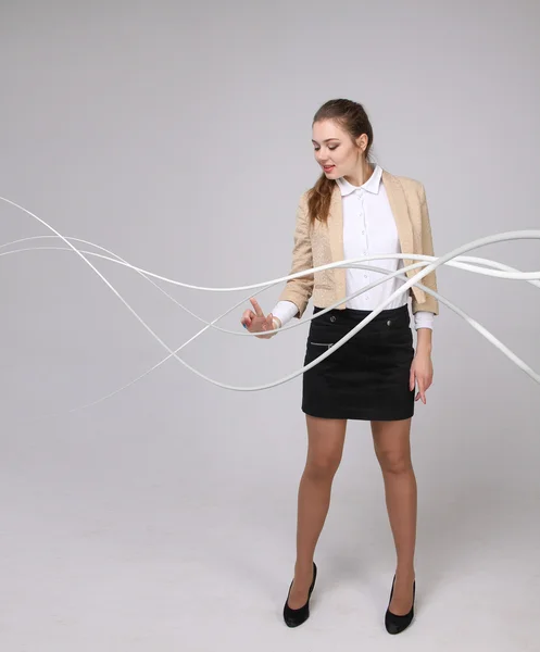 Mujer con cables eléctricos o cables, líneas curvas —  Fotos de Stock