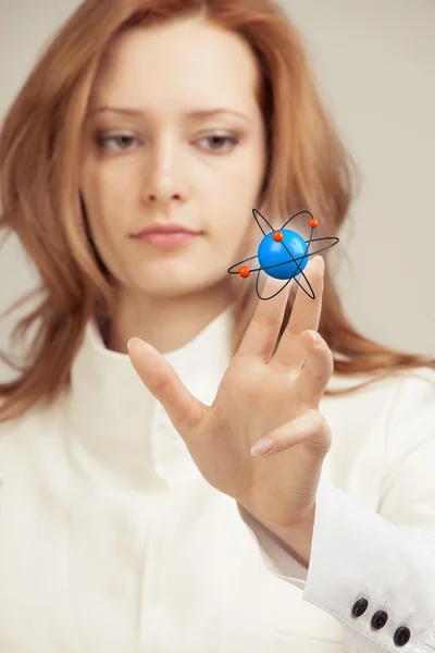 Woman scientist with atom model, research concept — Stock Photo, Image