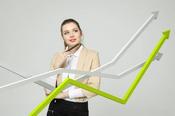 Businesswoman working with growth graph on grey background — Stock Photo, Image