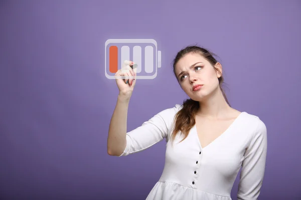 Young Businesswoman and battery level icon — Stock Photo, Image