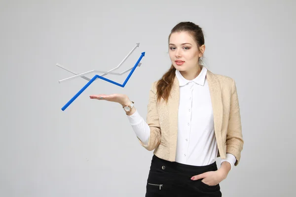 Businesswoman working with growth graph on grey background — Stock Photo, Image