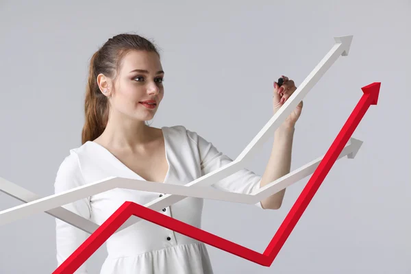 Businesswoman working with growth graph on grey background — Stock Photo, Image