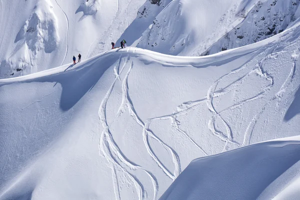 Snowboard freeride, snowboarders and tracks on a mountain slope. Extreme sport. — Stock Photo, Image