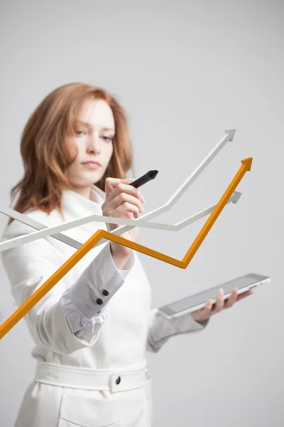 Businesswoman working with growth graph on grey background — Stock Photo, Image