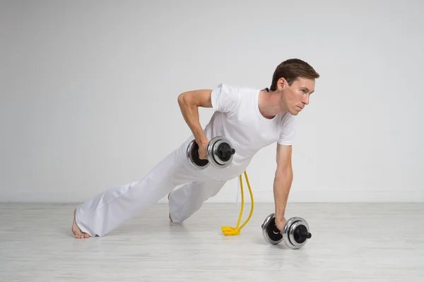 Young Man doing Exercise with Dumbbells. — Stock Photo, Image