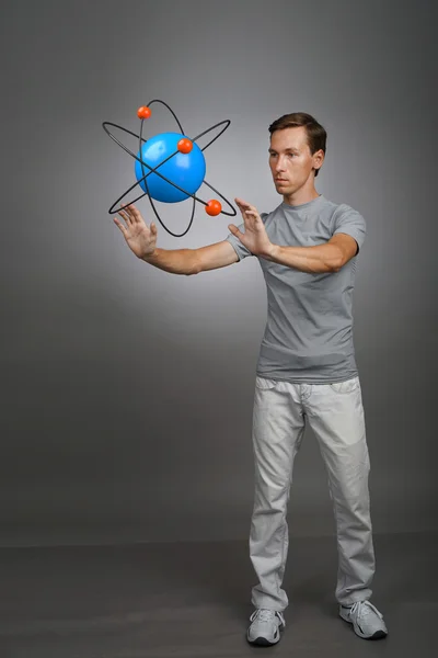 Man scientist with atom model, research concept — Stock Photo, Image