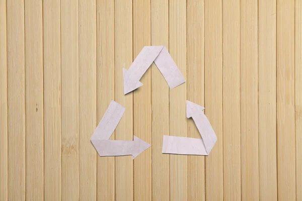 Natural bamboo texture and paper recycle symbol — Stock Photo, Image